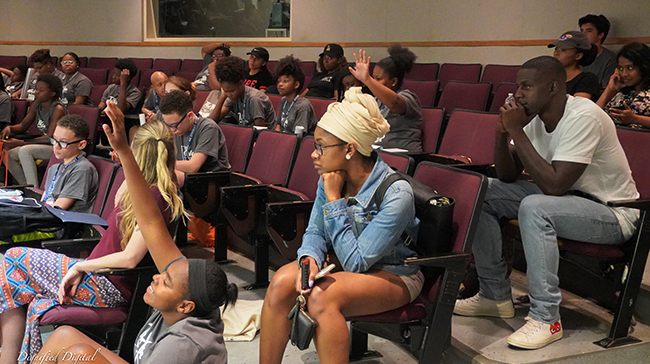 Students discussing in a classroom.